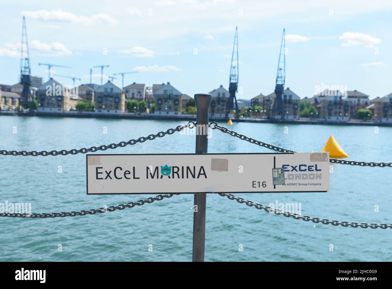 ExCel Marina, sign and view across the Royal Victoria Dock, London, UK Stock Photo