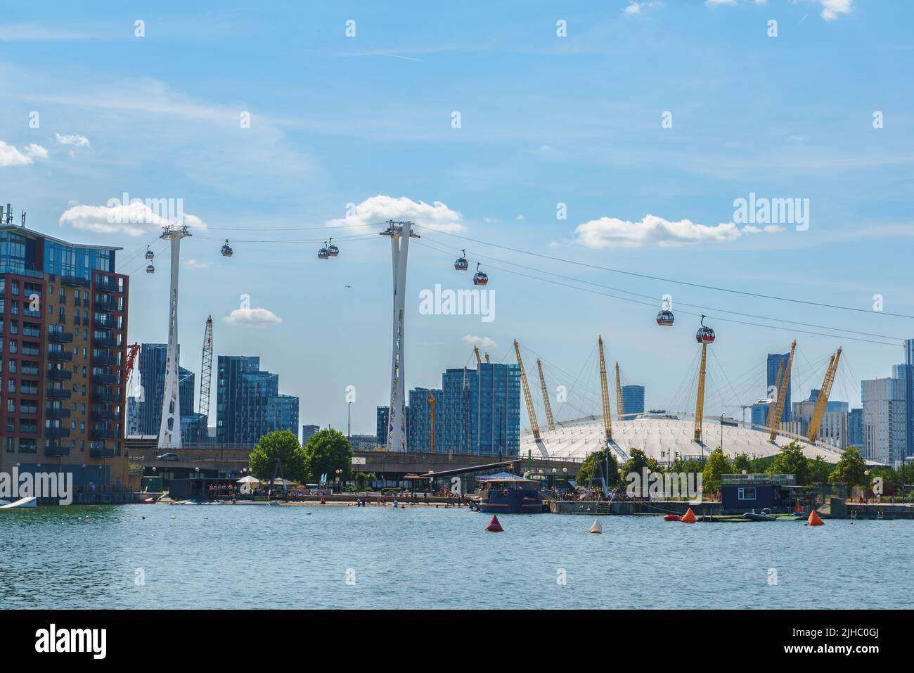 View across the Royal Victoria Dock towards the millennium dome, Docklands, London, UK Stock Photo