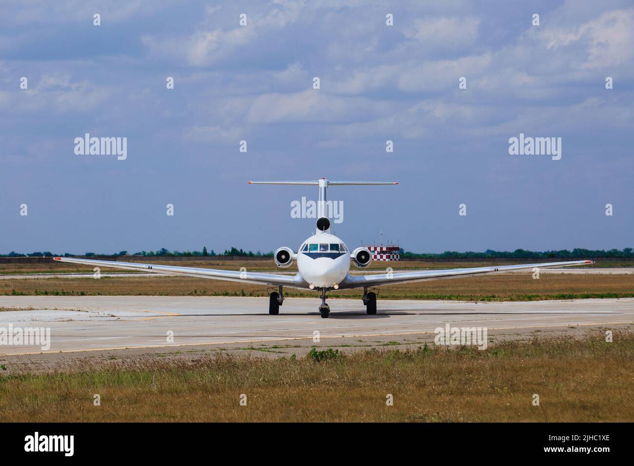 Airplane standing on airfield waiting for take off at the airport, evacuation. Stock Photo