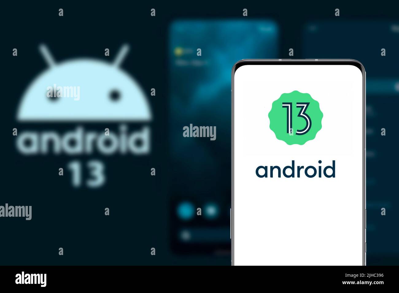 Android 13 logo and mobile interface on a smartphone screen. This ...