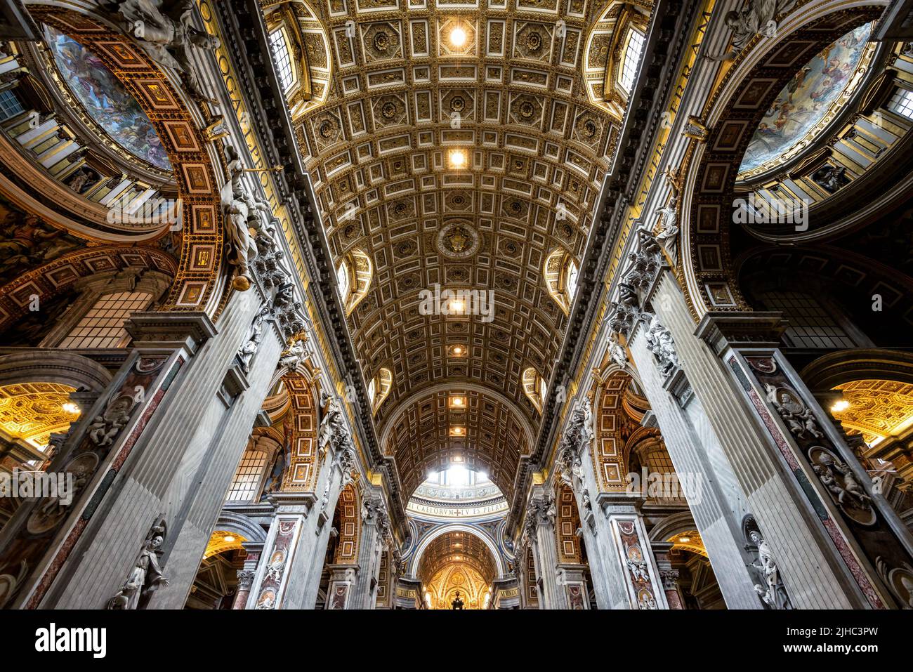 Rome - Jun 12, 2021: Inside St Peter Basilica, Rome, Italy. Saint Peters cathedral is top landmark of Rome and Vatican City. Ornate Baroque interior o Stock Photo