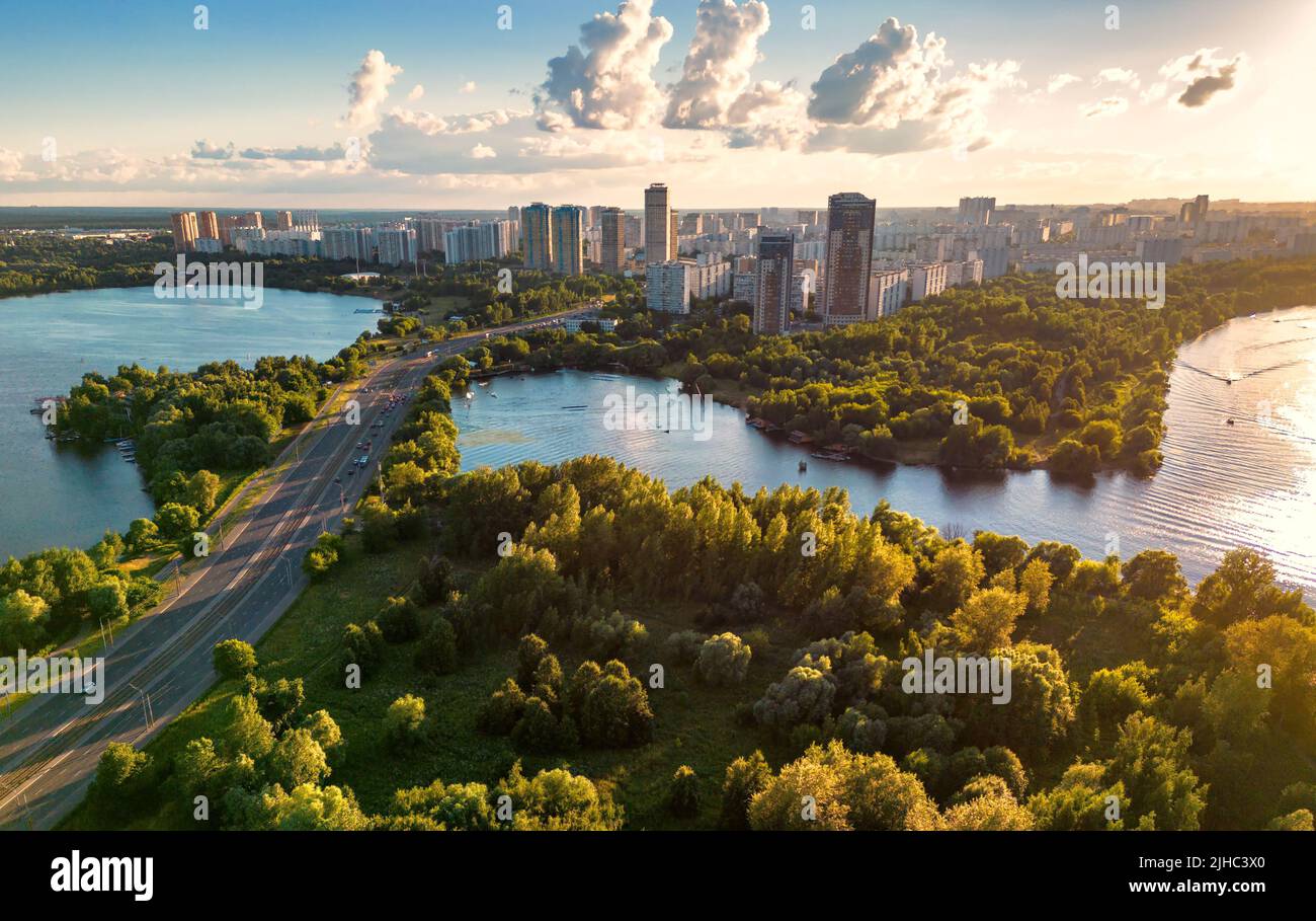 Moscow landscape at sunset, Russia. Scenic aerial view of Strogino district in Moscow northwest. Scenery of Moskva River bays and park in summer. Mosc Stock Photo