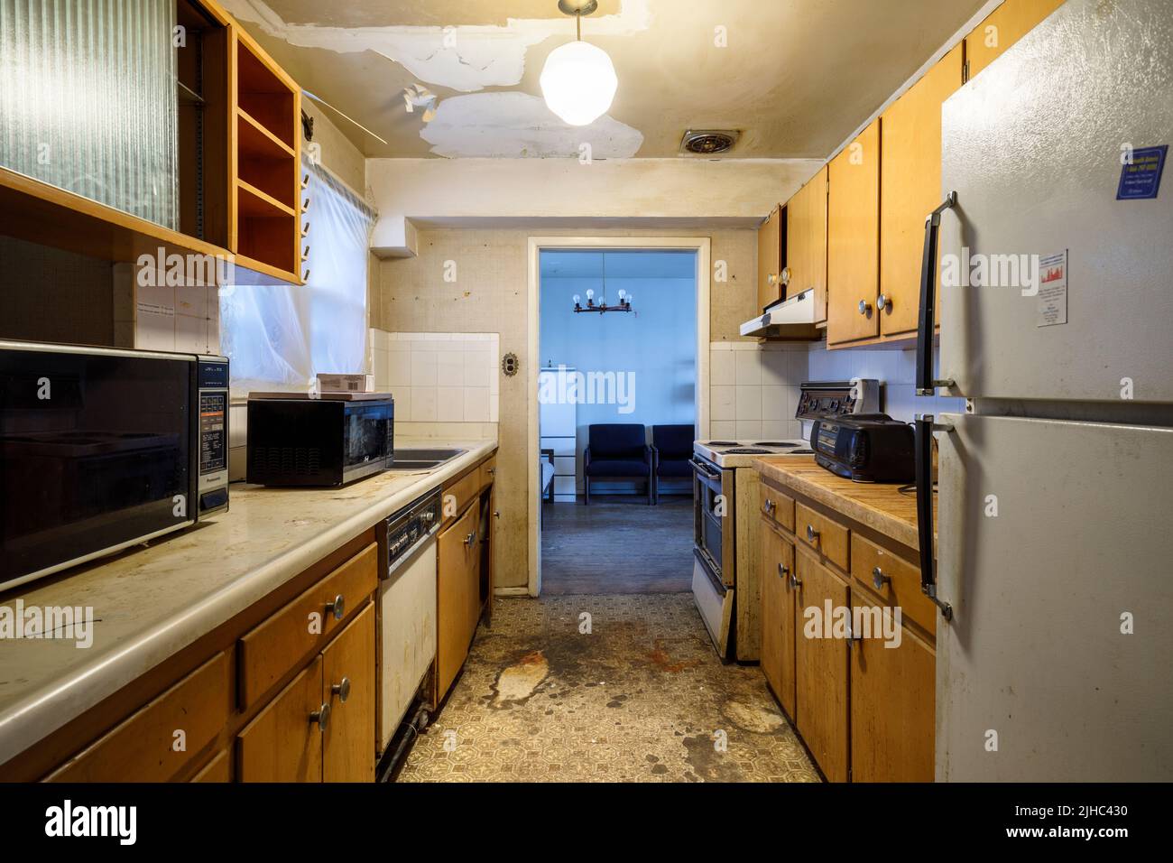 A filthy and worn 1950s kitchen. Stock Photo