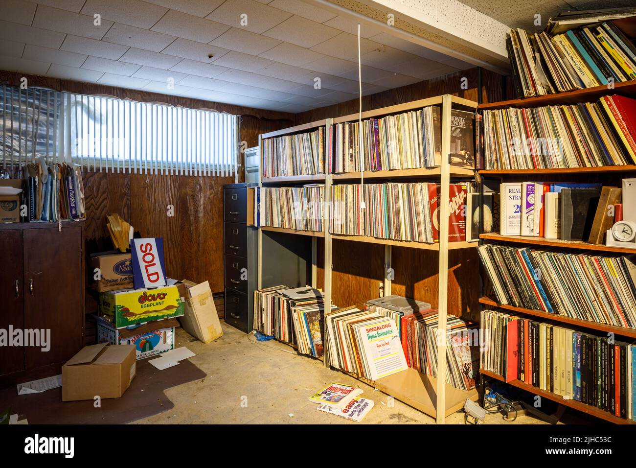 Shelves of vinyl records in a basement. Stock Photo