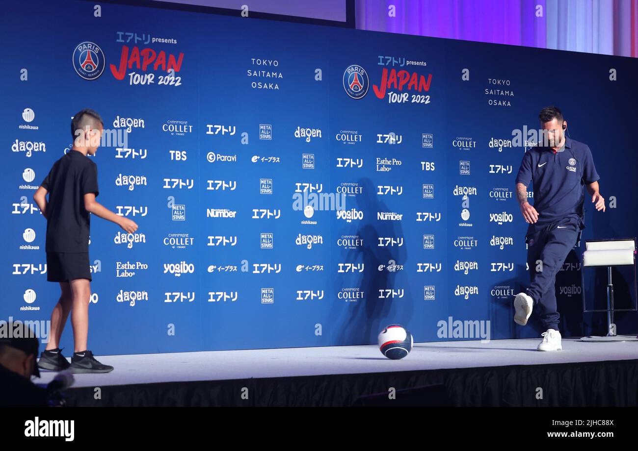 Tokyo, Japan. 17th July, 2022. (L-R) French football club team Paris Saint-Germain star player Lionel Messi (R) plays with a little fan at a press conference upon their arrival in Tokyo on Sunday, July 17, 2022. Paris Saint-Germain will have Japanese club teams Kawasaki Frontale, Urawa Reds and Gamba Osaka for their Japan tour. Credit: Yoshio Tsunoda/AFLO/Alamy Live News Stock Photo