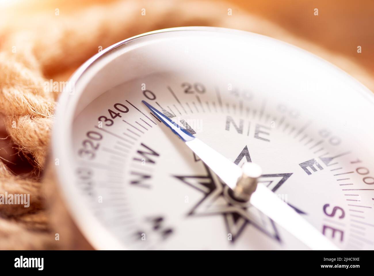 White geographic comp close up. Compass and rope Stock Photo
