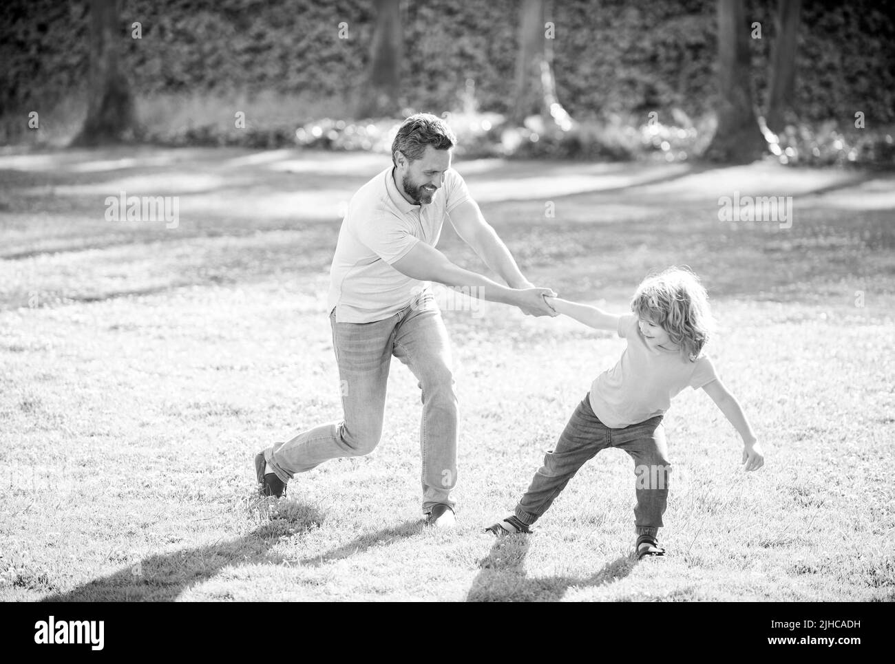 Happy father man and son child have fun summer outdoors, family Stock Photo