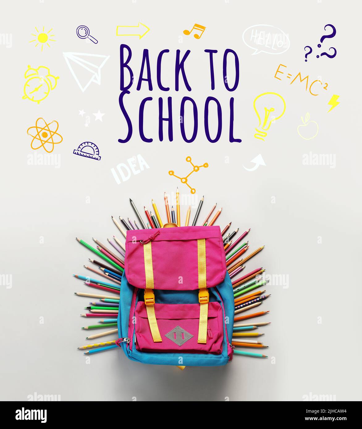 Backpack with stationery and text BACK TO SCHOOL on light background Stock Photo