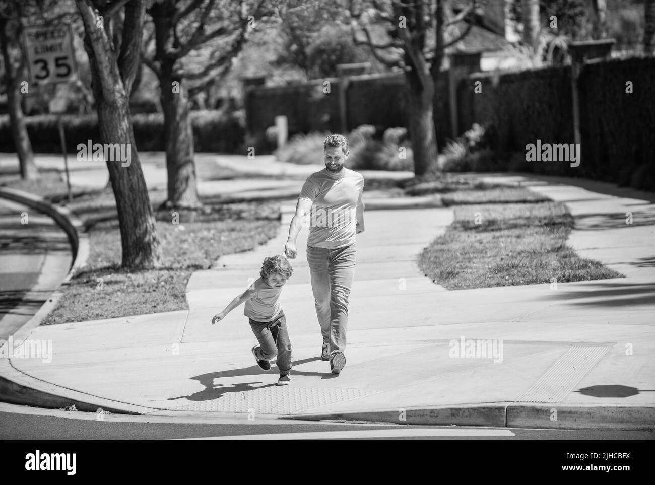 childhood and parenthood. parent relax with small child boy. dad with kid on summer Stock Photo