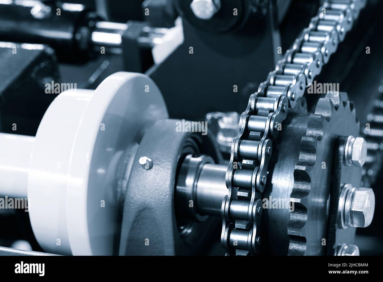 Gear chain drive shaft in conveyor belt is on production line. Timing