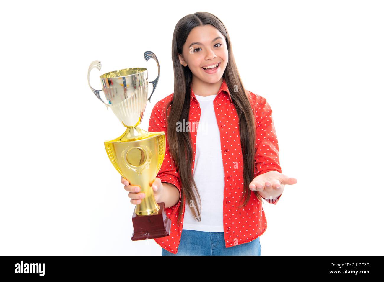 Teenage girl holding a trophy. Kid winner child won the competition, celebrating success and victory, achievement award. Portrait of happy smiling Stock Photo