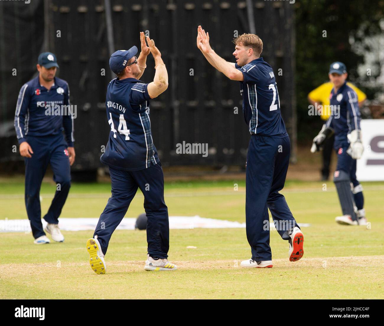 ICC Men's Cricket World Cup League 2 - Scotland v, Nepal. 17th July, 2022. Scotland take on Nepal for the second time in the ICC Div 2 Men's Cricket World Cup League 2 at Titwood, Glasgow. Pic shows: Scotland's Gavin Main is mobbed by teammates after dismissing NepalÕs Karan KC for 7 runs. Credit: Ian Jacobs/Alamy Live News Stock Photo