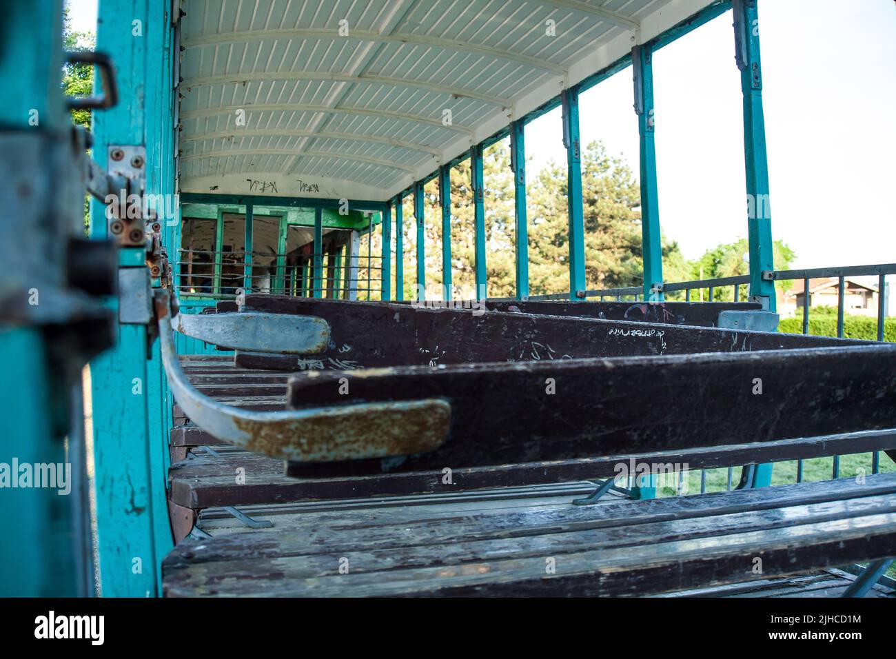 Inside old abandoned rusty wrecked tram Stock Photo