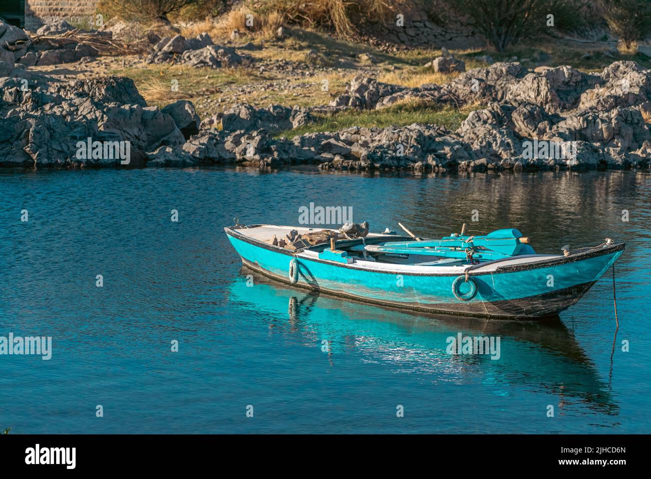 A blue empty boat on the surface of the Nile river Egypt Stock Photo ...