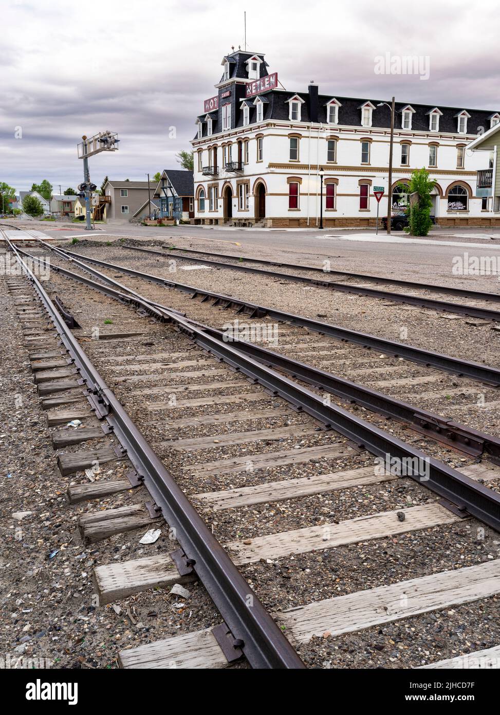 Along the rail tracks in Dillon Montana hotel and crossing lights Stock Photo