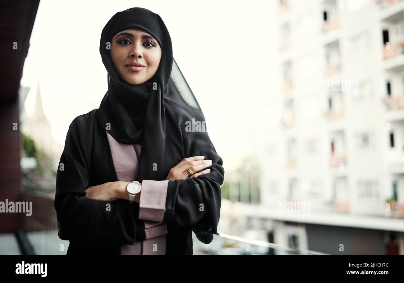 You need confidence to take risks. Cropped portrait of an attractive young businesswoman dressed in Islamic traditional clothing standing with her Stock Photo
