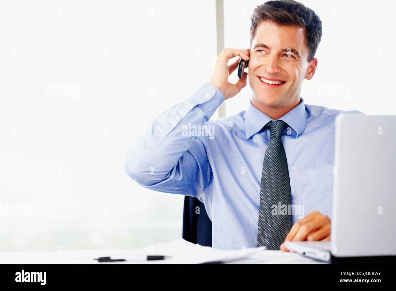 All about the business. a handsome young businessman working with a ...