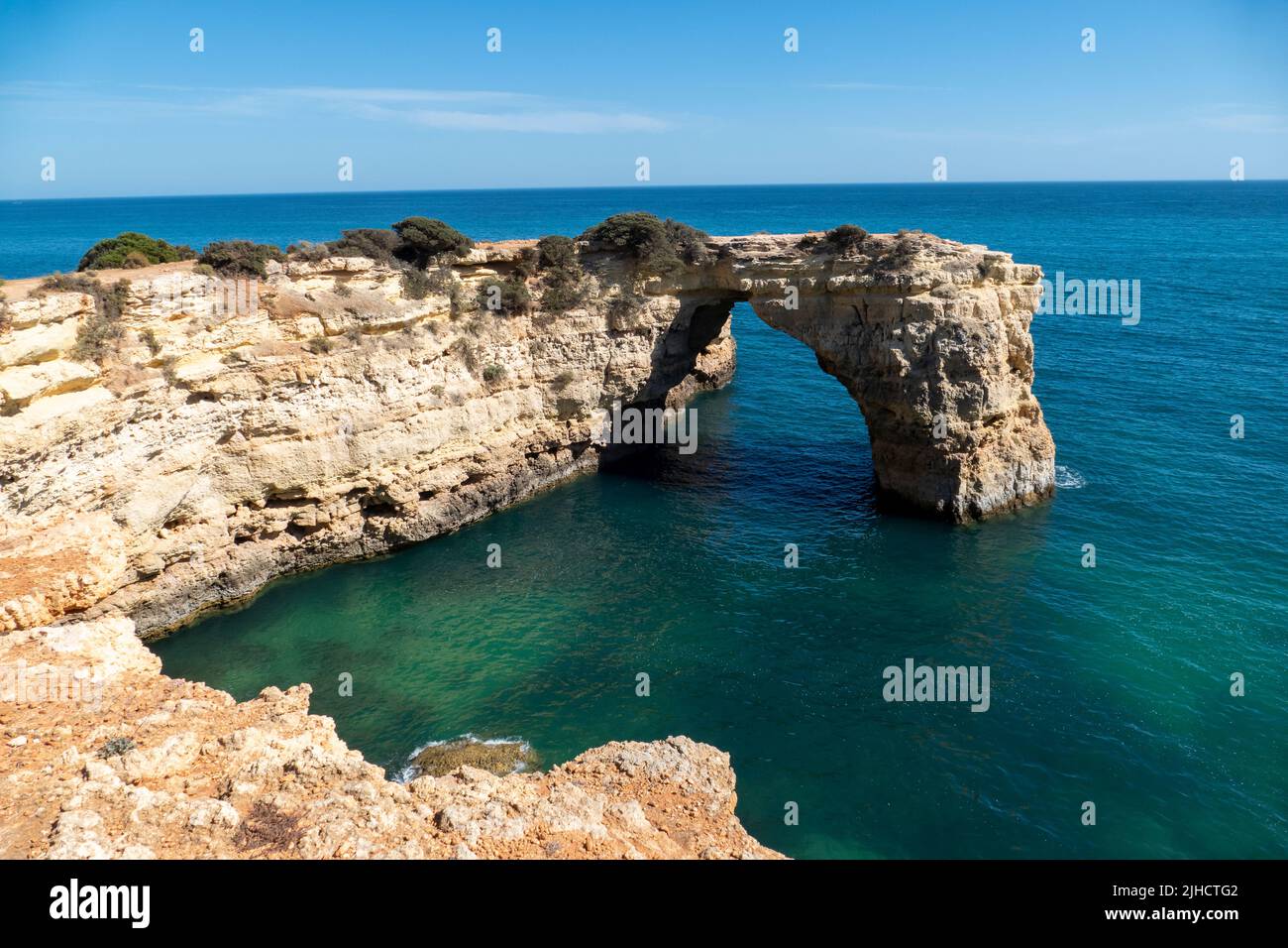 Natural Arch of Albandeira during low tide. Landmark in Lagoa, Algarve. Stock Photo