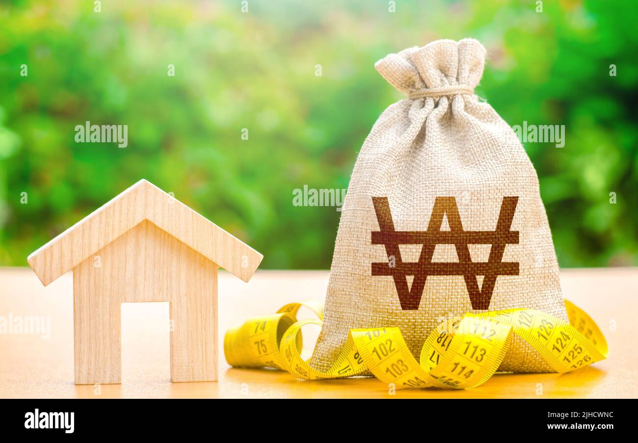 House and south korean won money bag. Mortgage loan calculation. Real