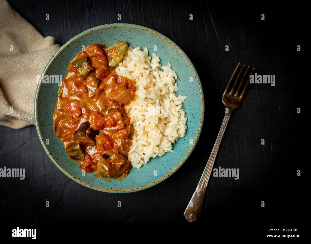 Eggplant curry with brown rice Stock Photo Alamy