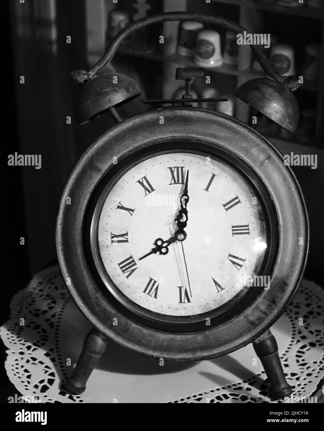 A vertical grayscale of an old vintage alarm clock Stock Photo Alamy