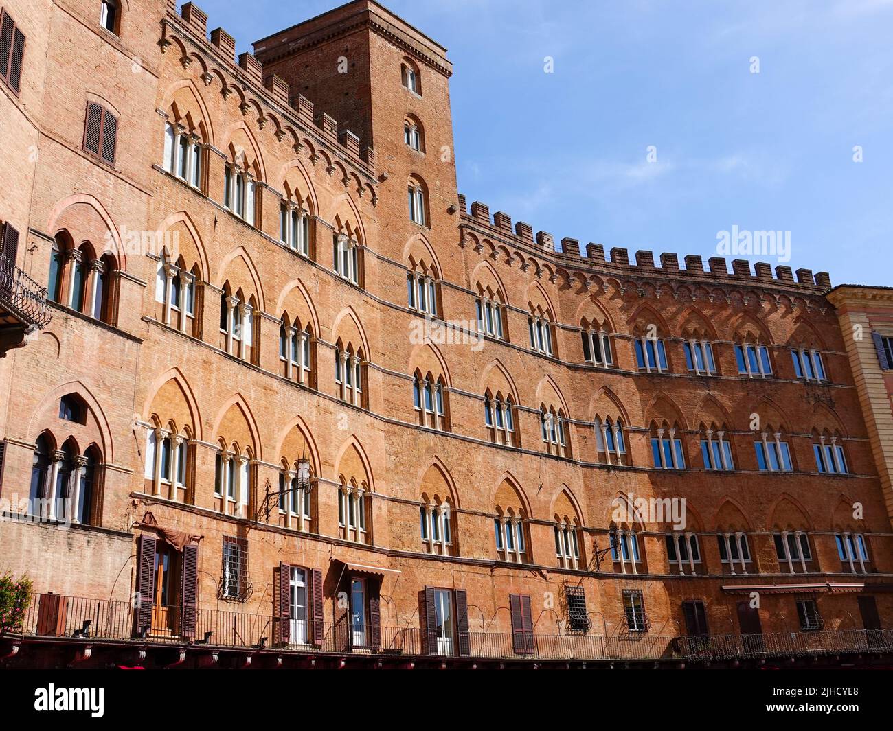 Red brick facade on buildings in the Piazza del Campo, Siena, Italy, located in the heart of Tuscany. Stock Photo