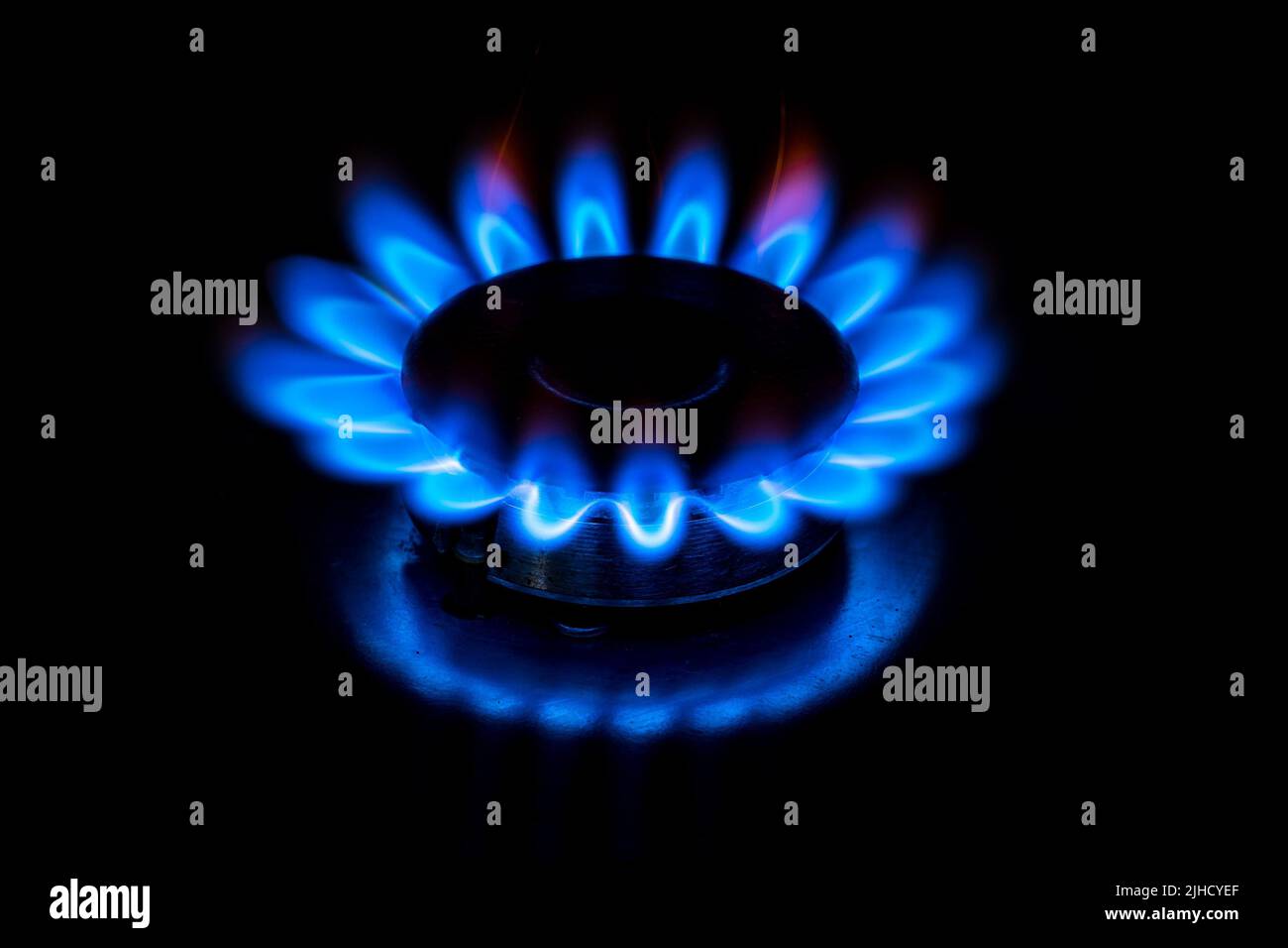 Gas cooktop burning gas stove with blue flame Stock Photo Alamy