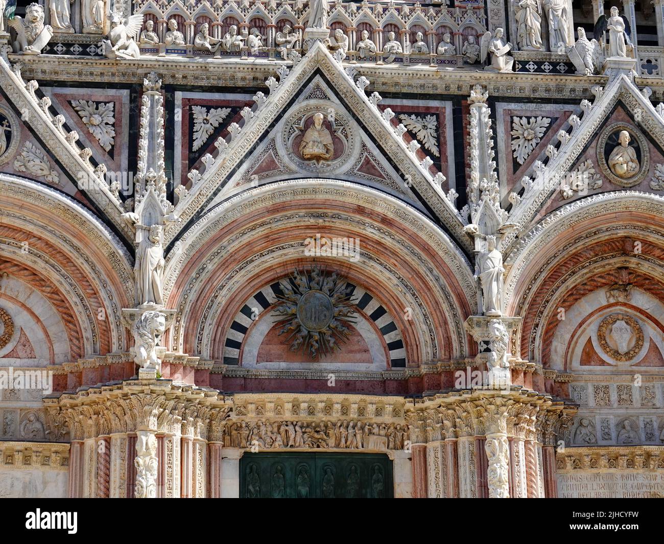 Exterior detail of the front facade, Duomo di Siena, historic cathedral in the heart of Tuscany, Italy. Stock Photo