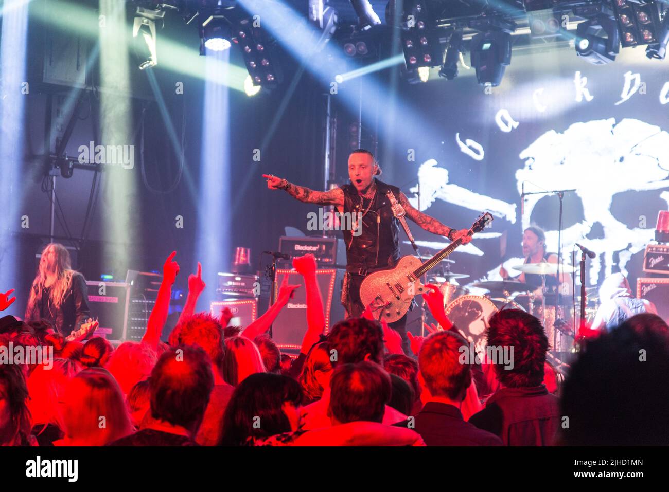 Backyard Babies on stage with Johan Blomqvist on bass; Nicke Borg on guitar and vocals; Dregen on guitar and Peder Carlsson on drums Stock Photo