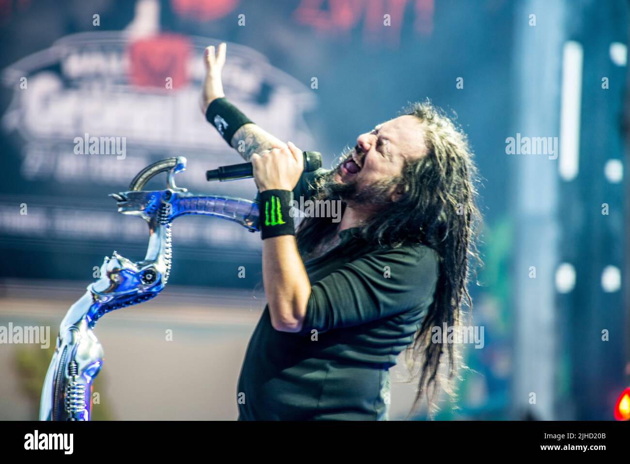 KoЯn during a gig and Jonathan Davis is the singer with his alien lady microphon pod. Stock Photo