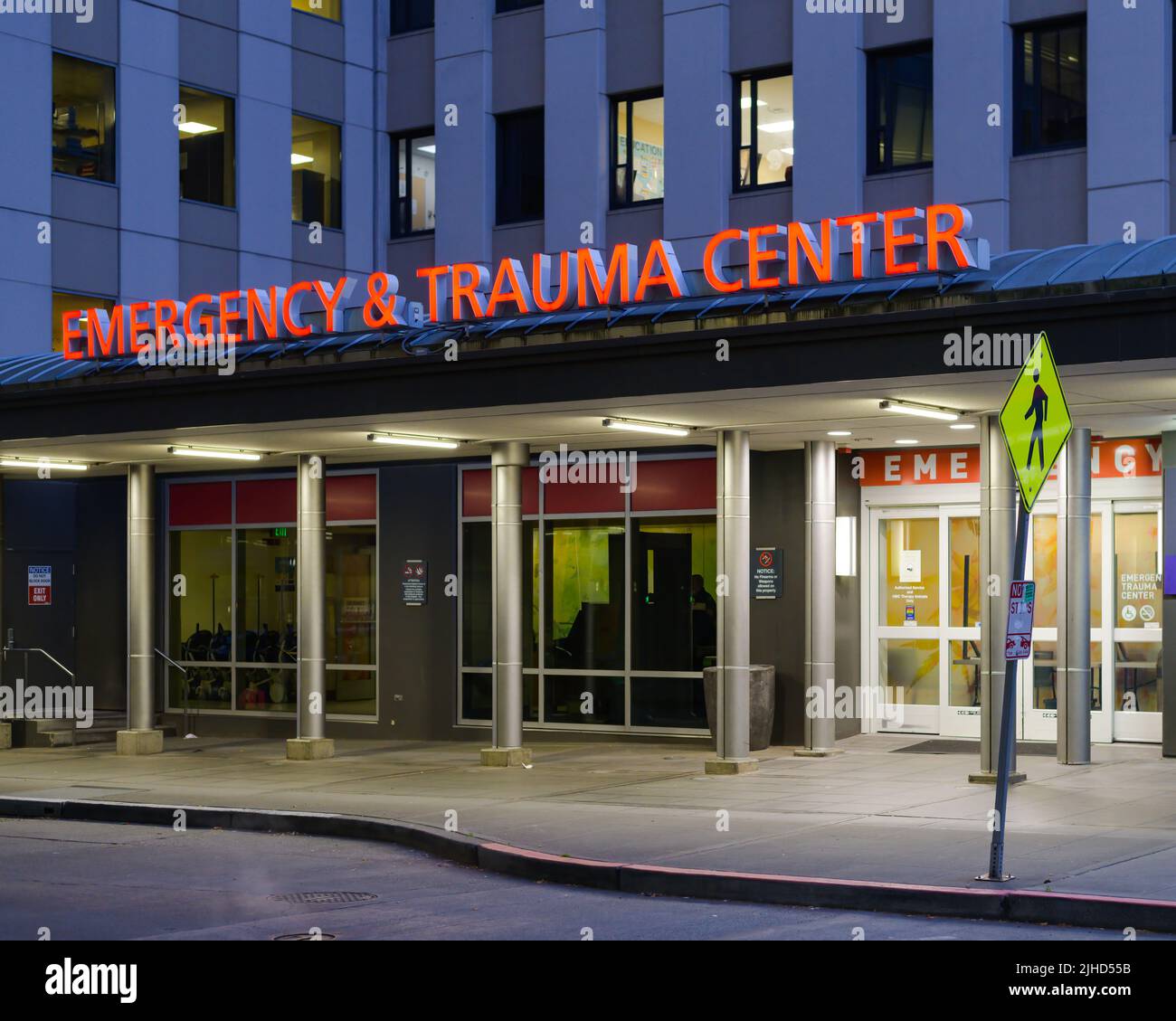 Seattle - July 09, 2022; Emergency and Trauma Center sign illuminated at Harborview Medical Center in Seattle over the entrance Stock Photo