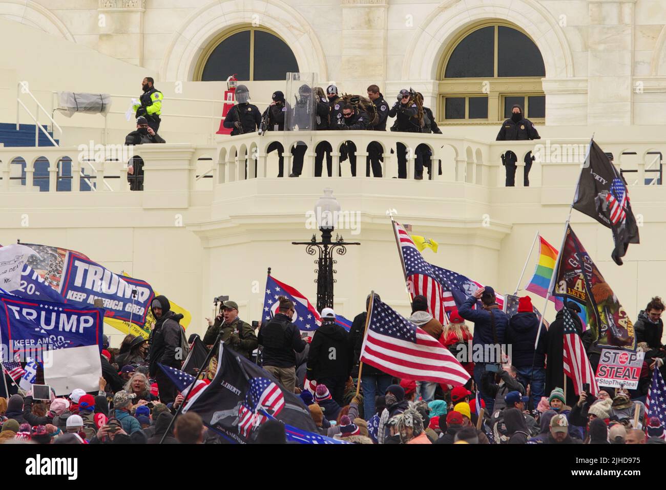 Police in riot gear watch as a mob of pro-Trump protesters gather at the U.S. Capitol on 6 Jan 2021. Stock Photo