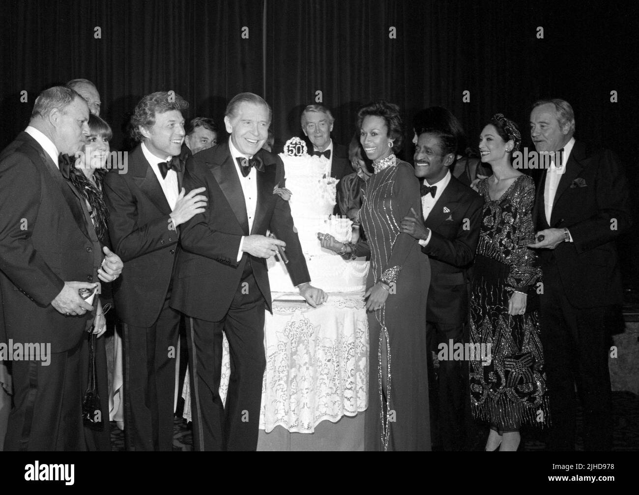 Milton Berle, Sammy Davis Jr., James Stewart, Angie Dickinson and Jack Lemmon pictured with Don Rickles, Steve Lawrence, Tom Bosley,,Altovise Davis and Suzanne Pleshette as the Friars Club of Beverly Hills Honor Sammy Davis Jr. with Lifetime Achievement Award at The Beverly Hilton Hotel on November 25, 1980. Credit: Ralph Dominguez/MediaPunch Stock Photo