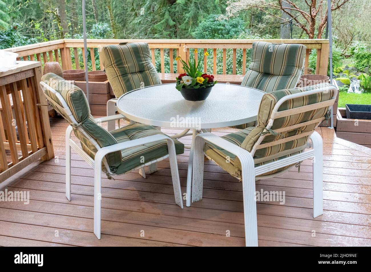 Issaquah, Washington, USA. Metal patio chairs and table on a composite