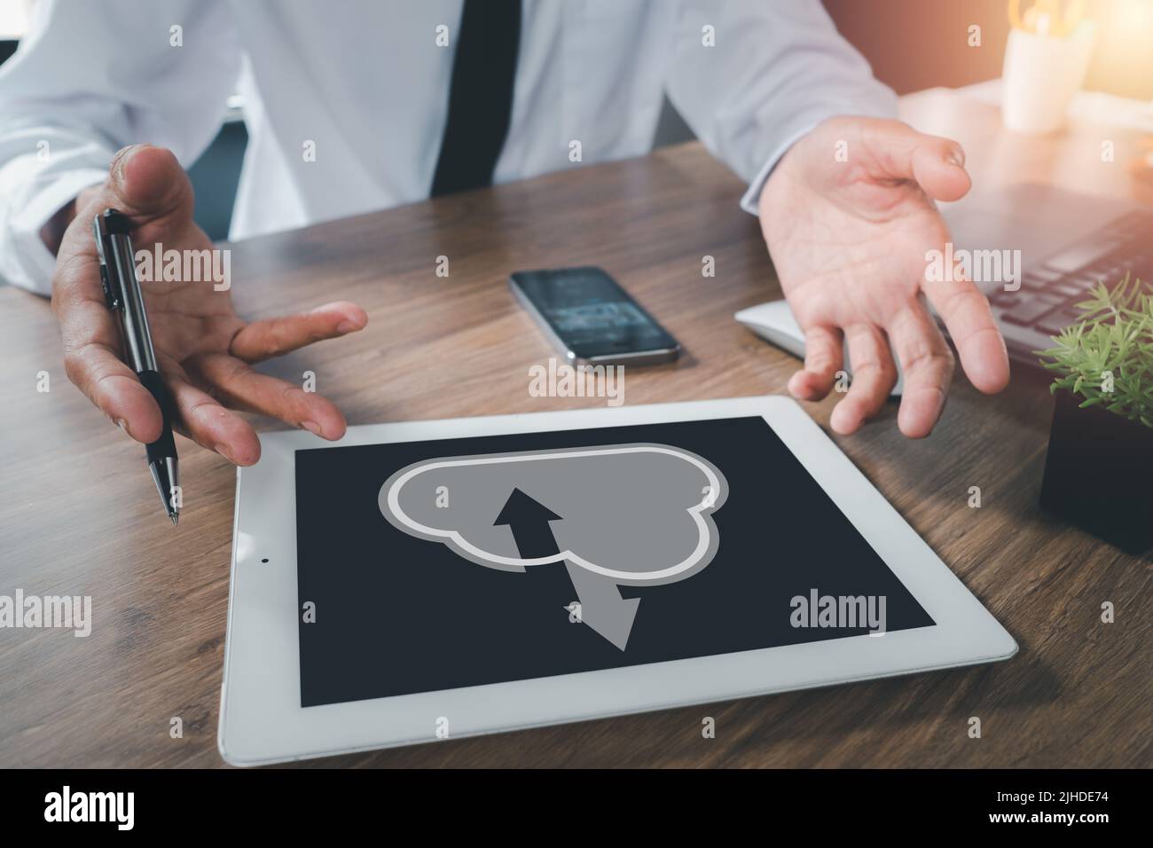 Businessman hand using digital tablet with cloud computing icon, Cloud computing concept, Backup Storage Data Internet, networking and digital, Share Stock Photo