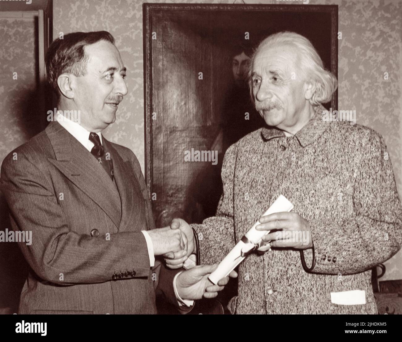 Albert Einstein (1879-1955) receiving an honorary Doctor of Philosophy degree from the Hebrew University of Jerusalem by Israel S. Wechsler at Einstein's Princeton home in March, 1949. (USA) Stock Photo