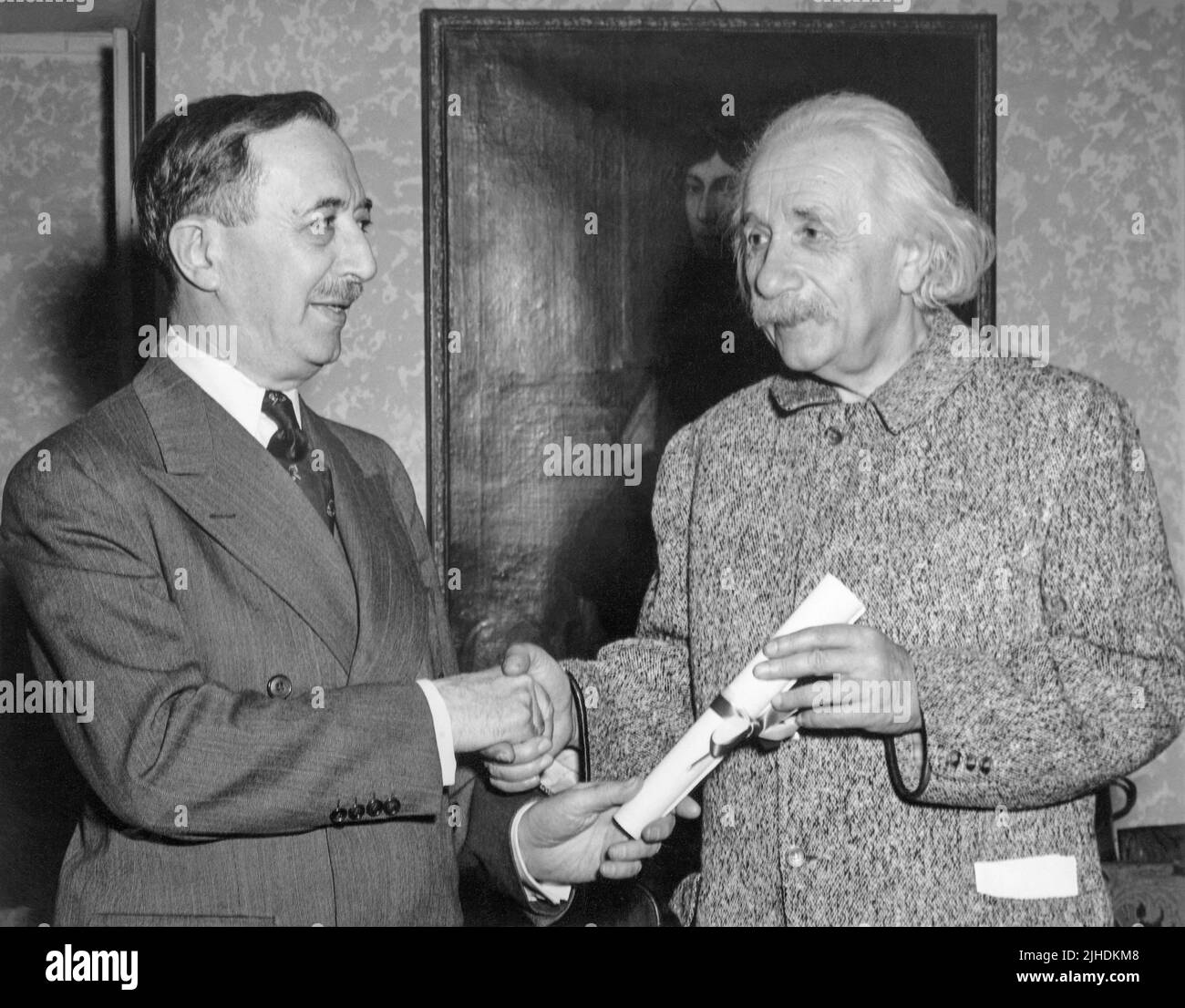 Albert Einstein (1879-1955) receiving an honorary Doctor of Philosophy degree from the Hebrew University of Jerusalem by Israel S. Wechsler at Einstein's Princeton home in March, 1949. (USA) Stock Photo