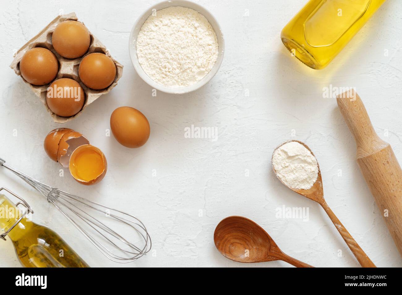 Preparation for baking. Eggs and flour on white background Stock Photo ...