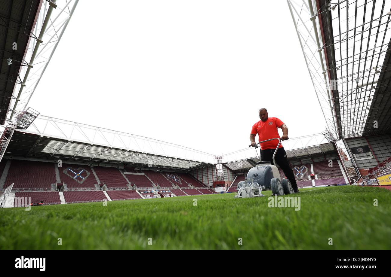 Edinburgh, UK : 16th July 2022 :  A Groundsman paints the lines on the pitch at Tynecastle Park before the pre-season friendly between Heart of Midlothian. Stock Photo