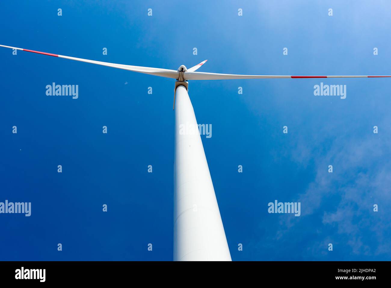 Low angle view, below under wind generator, turbines, with rotating