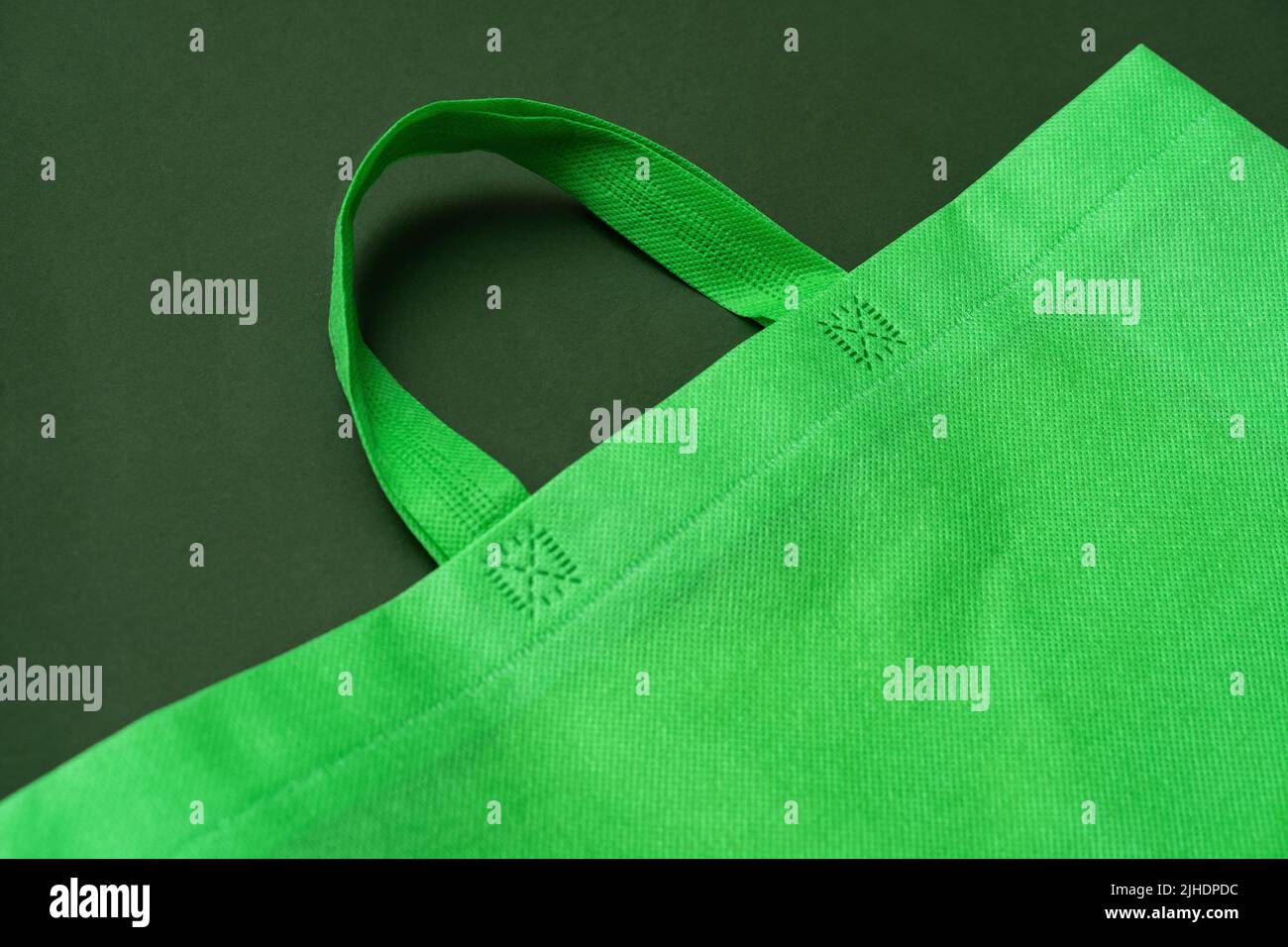 Textile shopping bag on green background flat lay Stock Photo - Alamy