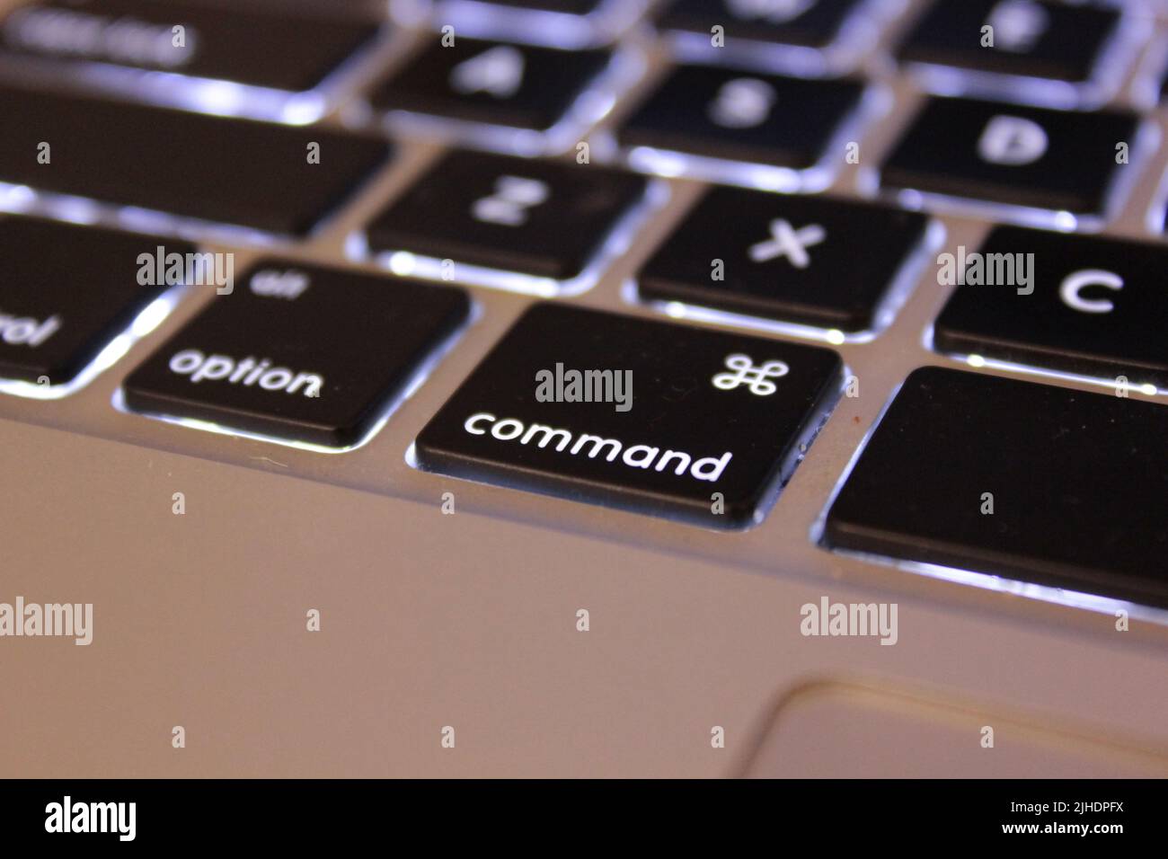 A shallow focus close-up of illuminated keyboard of a laptop Stock Photo