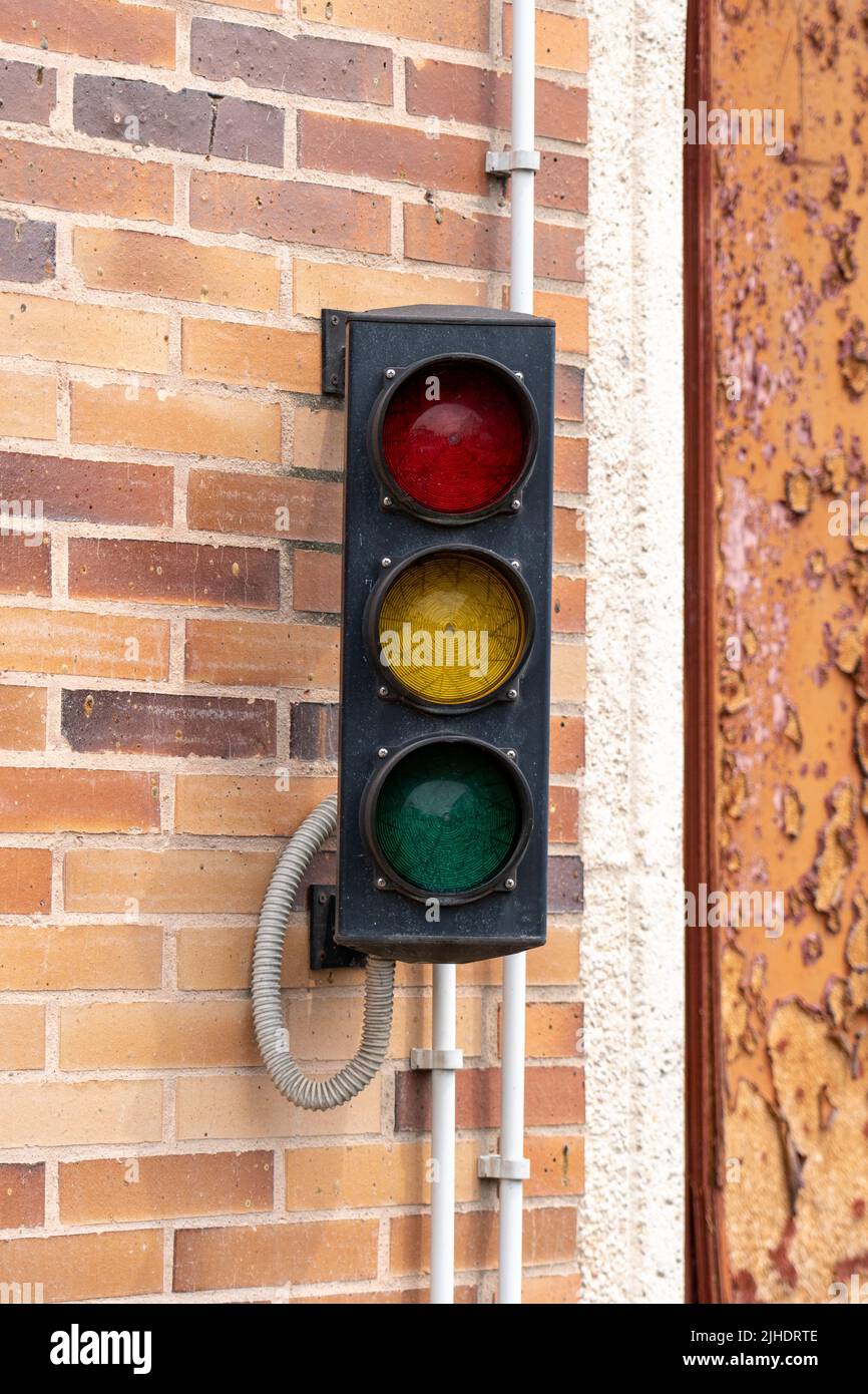 Old disabled nonworking traffic light in the parking closeup Stock