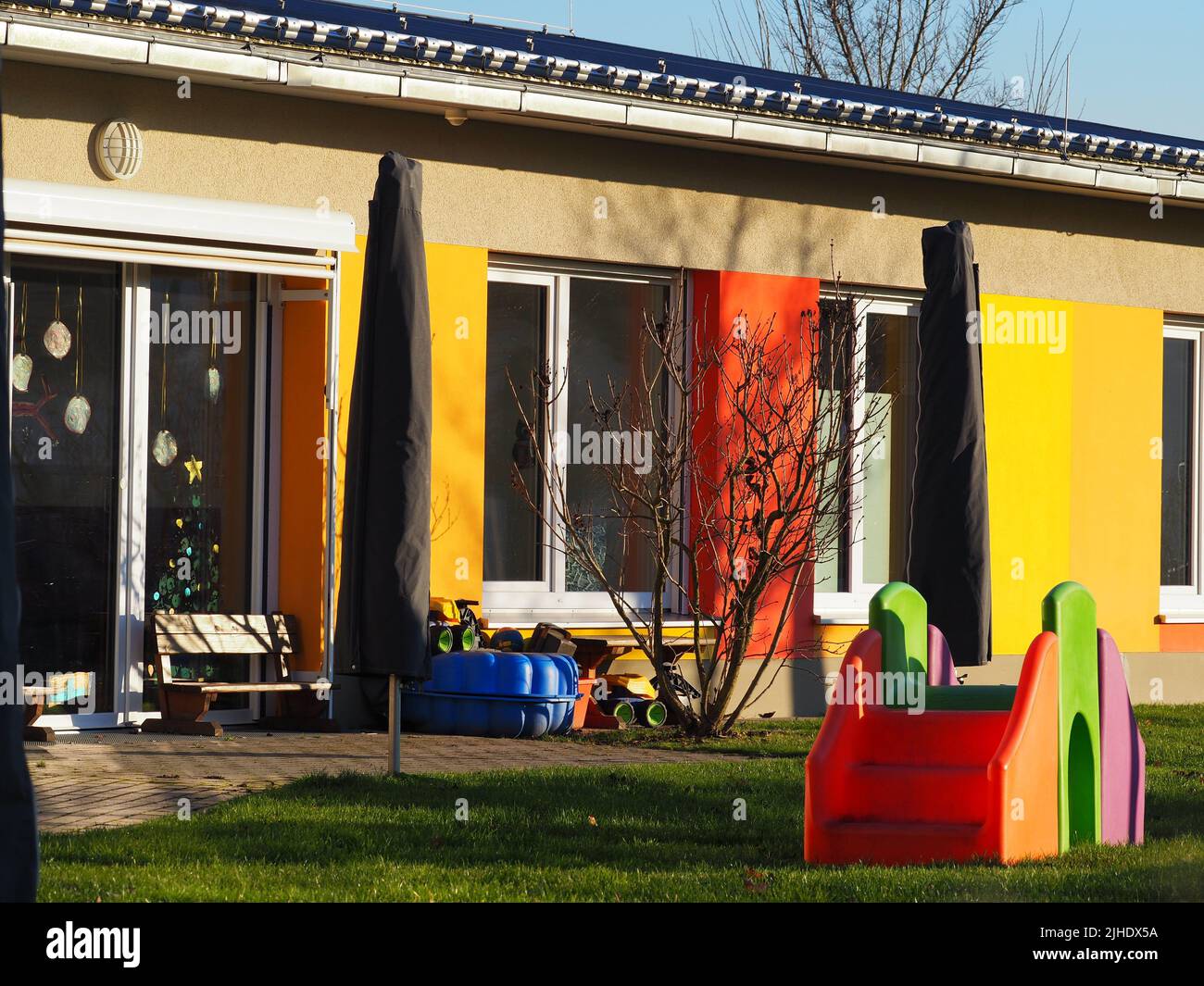 An outdoor kindergarten playground with colorful walls and equipment An outdoor kindergarten playground with colorful walls and equipment