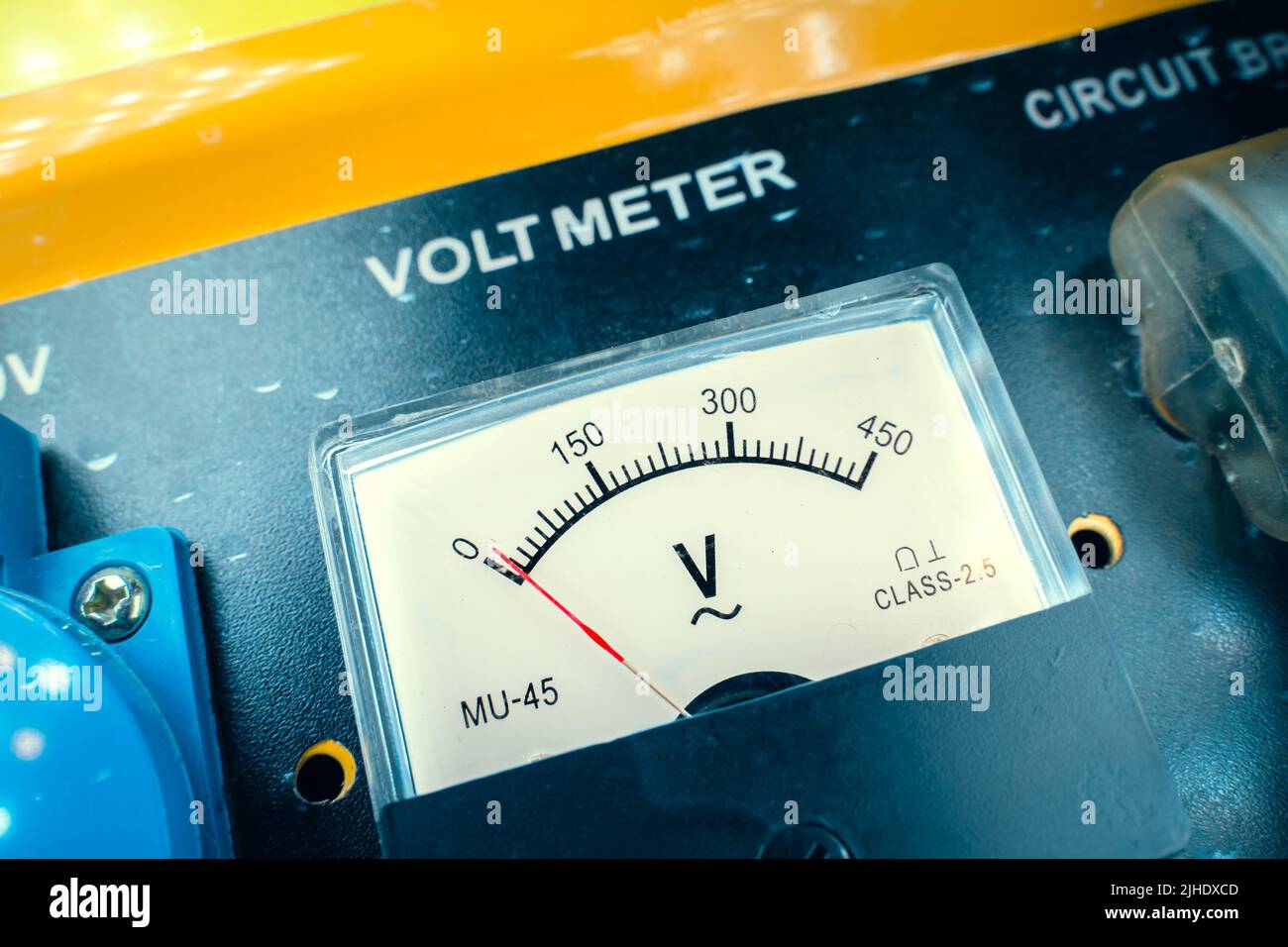 Mechanical voltmeter close up. Voltage measuring device on a gasoline