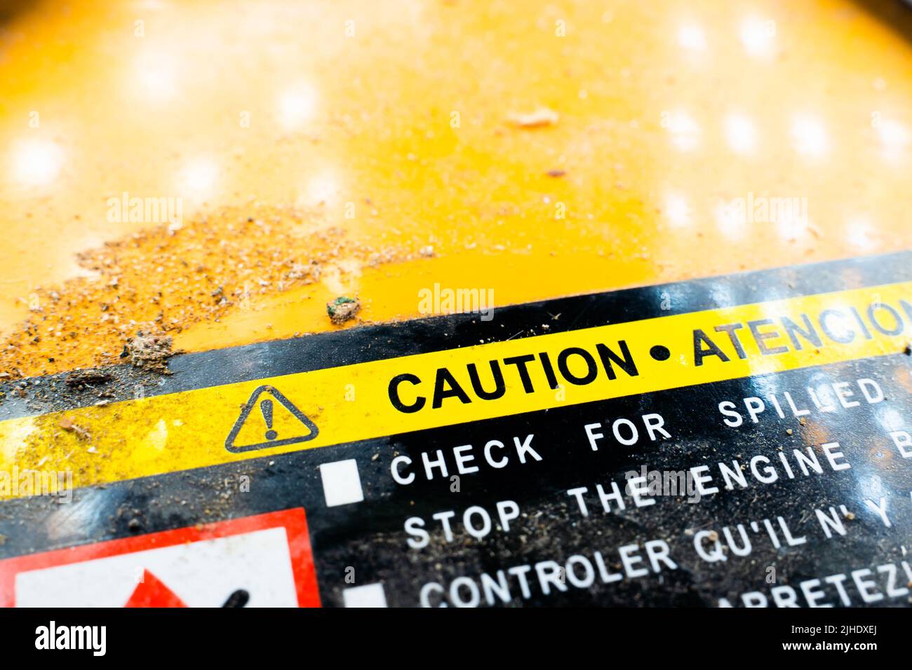 Hazard warning sticker on the gas tank of a gas generator closeup