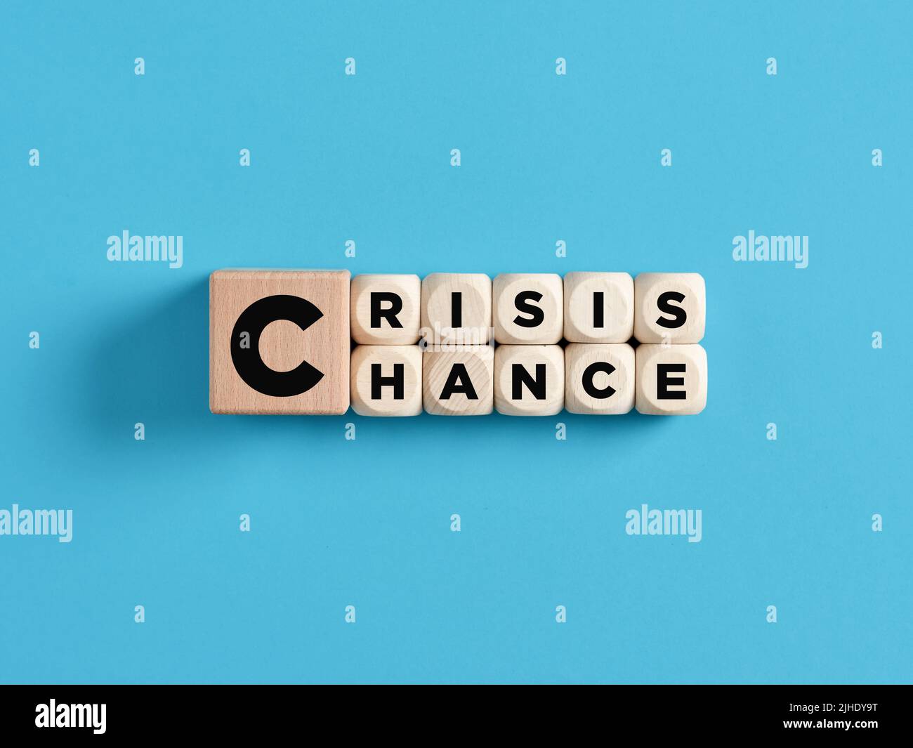 Transforming crisis into a chance concept. The words crisis and chance on wooden cubes. Stock Photo