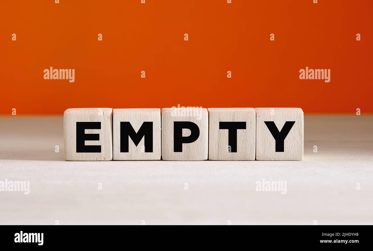 The word empty on wooden cubes on orange background with copy space. Stock Photo