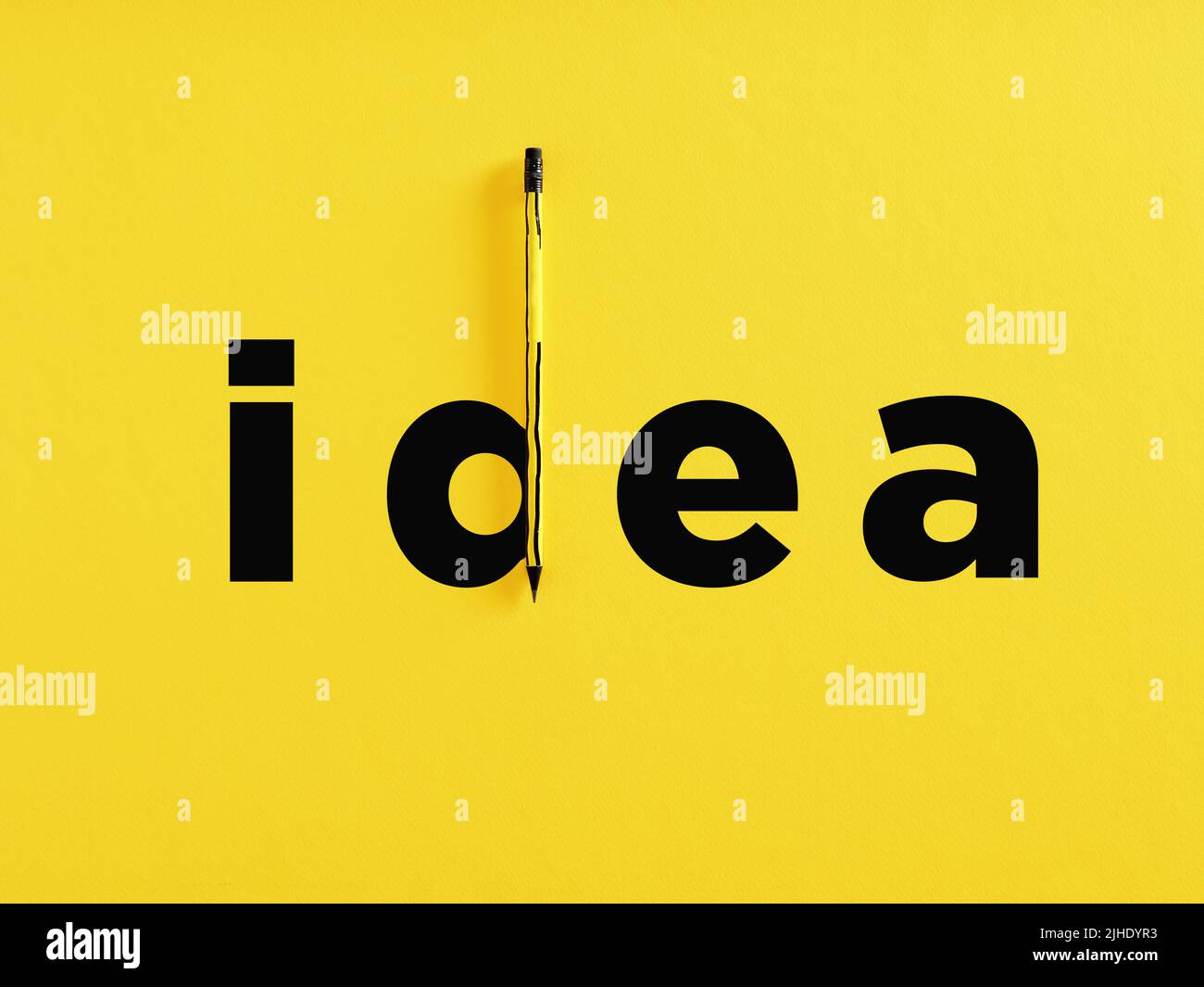 The word idea with the letter d completed with a pencil on yellow background. Creative idea and creativity in business or education concept. Stock Photo