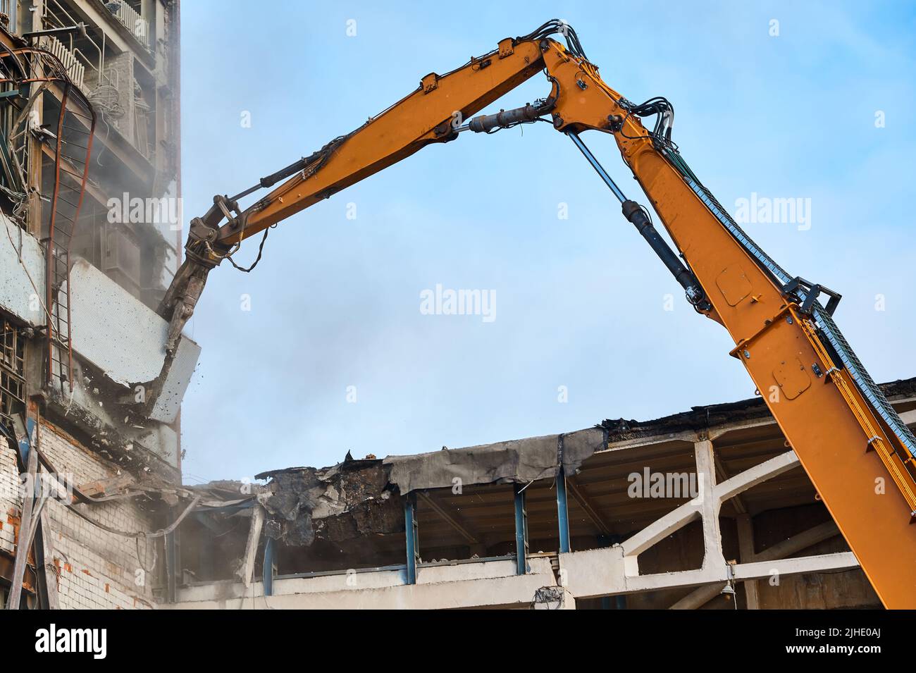 Hydraulic scissors on rig of crane cut building on site Stock Photo Alamy